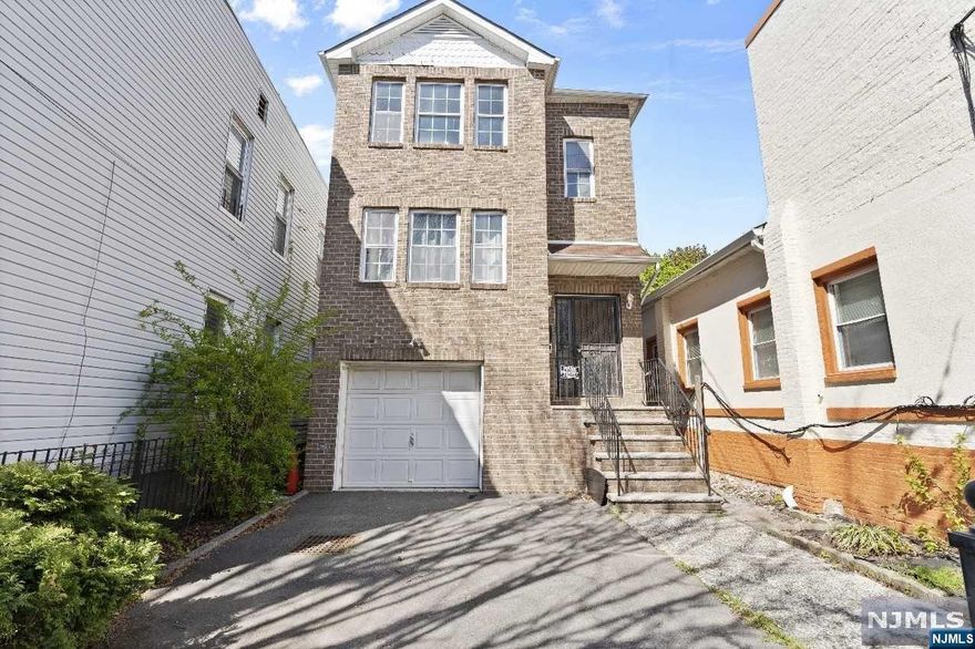 Nestled in Newark City's Clinton Hill neighborhood, this charming 2-family home offers the perfect blend of comfort and convenience. The home consist of a renovated 2nd floor unit, with a 3-bedroom, 2-bath layout which features modern amenities, and a laundry room for a washer and dryer. The second unit is meticulously kept with 3bedrooms, 2 bathrooms, which connects to the renovated basement, garage and laundry hookups in basement . There's ample room for storage and vehicles. Delivered vacant, this duplex is ready to welcome you home to the Clinton Hill community!