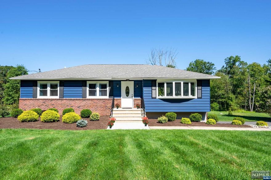 Fully renovated 4 BR, 2-full bath Ranch sits on 1.5+ acres with a two-level rear deck for entertaining! Enter to an open floor plan LR, DR and kitchen featuring quartz countertops, waterfall island with pendant lighting, ss appliances including gas range w/pot filler & built in microwave. Main level has primary BR w/ ensuite and WIC, plus 3 additional bedrooms and the main bath. HW floors and recessed lighting throughout. Finished basement with CA features a spacious recreation room with a wine closet, laundry/utility room, and walk-out to the oversized 2-car built in garage. All new in 2021; roof, windows, doors, furnace, hot water heater, central air, garage doors/openers, fixtures and LED lighting, professional landscaping, walkway, steps, retaining wall, two level deck, septic system and french drains. All this AND it's near parks, schools, houses of worship, shopping, restaurants, and major highways.