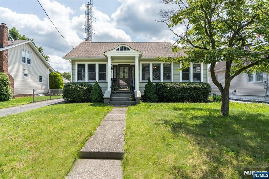 Charming Ranch in Prime Location! Welcome to this delightful home offering the perfect blend of comfort, style, & convenience. Nestled in a terrific neighborhood, this residence is flooded w/natural light, making it feel warm & inviting from the moment you step inside. The spacious living room is bathed in sunlight, showcasing stunning wood floors that flow seamlessly throughout the home. A generous formal dining room provides an ideal space for gatherings & entertaining guests. Updated kitchen features a large oversized bay window, allowing natural light to pour in, creating a bright & cheery atmosphere. Main floor boasts two cozy bedrooms, a bonus office perfect for work or study, & a full bath. The finished basement is a true highlight. You'll find a beautifully designed family room that provides a perfect retreat for relaxation or entertainment. The space also includes a convenient laundry area, a powder room, & ample closet space for storage. Step outside to the screened, covered patio, ideal for enjoying those three-season evenings in comfort, while overlooking the large rear fenced-in yard perfect for outdoor activities, gardening, or simply enjoying nature. The huge detached garage offers plenty of space for vehicles, tools, or a workshop. Notable updates include newer electric, insulated main floor walls, new furnace, & hot water heater for your peace of mind. Commuters delight w/NYC bus on corner & Express park & ride a few miles away. Close to restaurants!