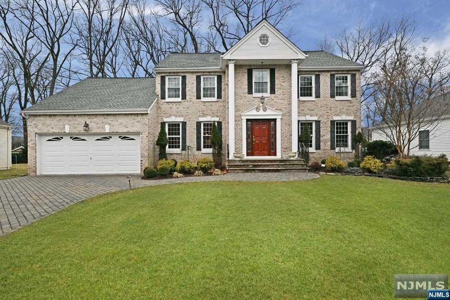 Stately Center Hall Colonial nestled on top of a wonderful Cul-de-sac! Built 1987 with over 3200 sq. ft. Main floor boasts large entry foyer, formal living room, formal dining room, spacious study w/built-in bookcase, gourmet granite kitchen with center-island/double oven/pot filler/farm sink and spacious dining area, great room offers a stunning fireplace and cathedral ceiling with sky lights, the bedroom ensuite and laundry room are off the kitchen. The 2nd floor boasts large master bedroom w/2 walk-in closets and master bath w/double sinks, soaking tub and shower stall. Additional 3 large bedrooms plus full bath. The basement is immense and fully finished w/large recreation room, office, full bath and large storage rooms! The property and setting are beautiful with paver driveway, brick exterior and large rear deck overlooks the private park-like property! 6 Zone BB Heat. Great Location close to schools, shops, restaurants and close to Westwood Town Center & Transporation!