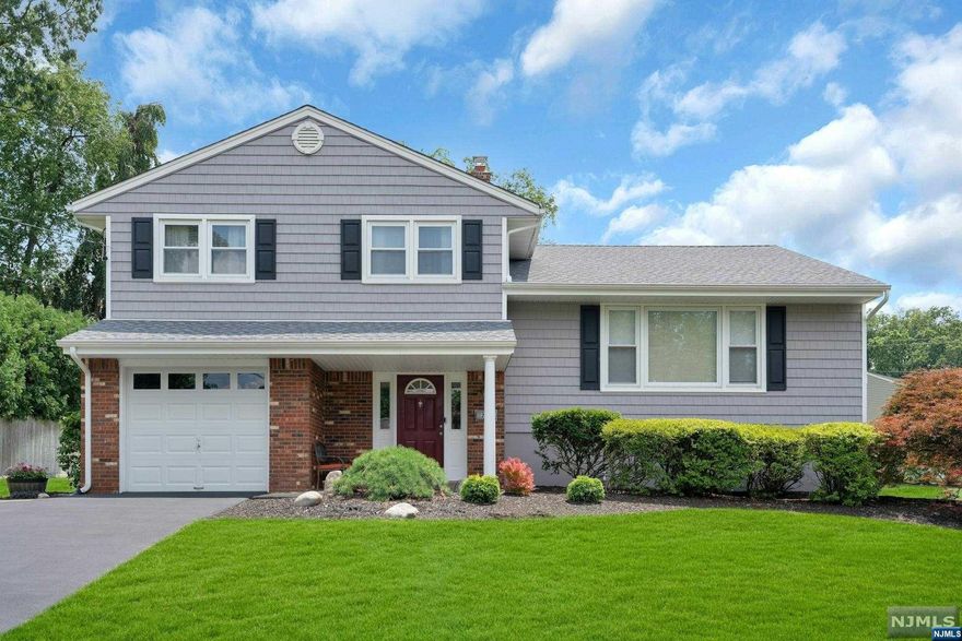 Excellent location! Do not miss this amazing opportunity to make this home your own in highly sought after Paramus. This move in condition 3 Bed 1.5 Bath S/L is located on a wonderful cul-de-sac on a large .37 acre lot. Step inside to a spacious entryway, leading to family room with access to patio and oversized backyard. Laundry and half bath also on ground floor. The first floor offers a large formal living room and formal dining room with hardwood floors, and eat-in- kitchen. The second floor features 3 bedrooms, all with hardwood floors and a full bath. Full unfinished basement waiting to be done for extra living space. Central air, 1 car attached garage, lots of closet & storage space throughout. Close to schools, shopping, houses of worship, and NYC transportation. Perfect home to build upon, or simply move in & enjoy. Take advantage of the low taxes Paramus has to offer.