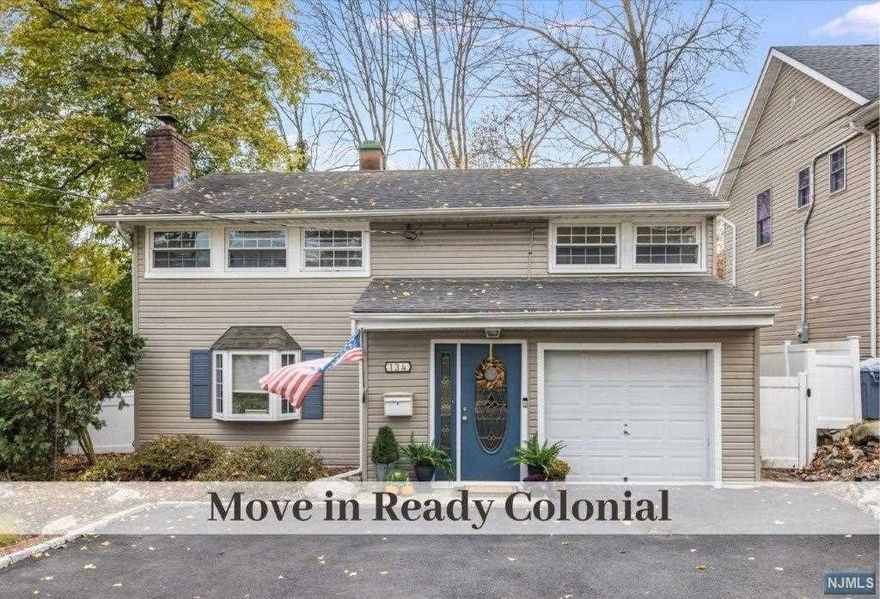 Updated Move in Ready, Zamore Colonial. Spacious Living Room with Wood Burning Stone Fireplace & Shiplap Wall. A welcoming open floor plan with easy flow living & dining rooms. Dining room features 3 large windows and access to an outdoor patio, perfect al fresco dining! The fresh white kitchen has stainless appliances and subway tile backsplash. Convenient PR, laundry/mudroom with access to garage & fully fenced backyard. The second floor offers 3-4 bedrooms with ample closets and stunning renovated full bathroom with double sinks, quartz counters and tile flooring. Siding, Windows, Central Air, and Roof updated in 2015. New double driveway with belgium block has a single car garage & newly poured cement floor. Located close to Blue Ribbon School, Town & Shopping, Train and Bus for NYC.