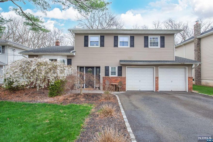 4 bedroom 2.5 bath Colonial Eat in Kitchen with stainless appliances and center island dining room with sliders to patio and large level yard master bedroom with full bath main bath features whirlpool tub 2 car garage
