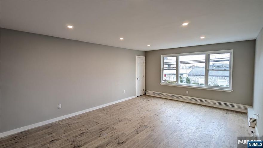 Completely Renovated 2nd floor Apartment above Justin's Restaurant. 2 off-street parking spots included behind building. Large and bright living room, brand new modern kitchen, two spacious bedrooms and beautiful new tiled full bath. New flooring and lighting throughout and freshly painted. Tenant pays own utilities. Fridge not included. Stackable laundry hookup in unit. Sorry, no smoking and no pets. Landlord requires 1.5 months security deposit, rental application, credit report (credit must be in EXCELLENT standing), income verification, proof of identity and interview required. Close to parks, shopping and transportation!