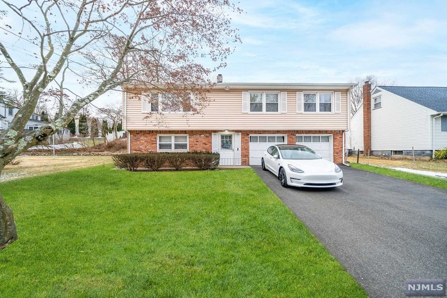 Welcome to 19 Maplewood Ave in Wayne, a beautiful corner lot raised ranch with lake views in a quiet tree-lined neighborhood. This home features 3 bedrooms, 2 bathrooms, finished ground level, and an oversized 2 car garage. The main level has an open floor plan featuring a large living room, dining room, eat in kitchen, 3 large bedrooms and a full bathroom. The ground level has a large finished family room with a brand new full bathroom, laundry room, direct access to the garage, and a storage room. Enjoy upgraded HVAC, upgraded electric and recessed LED lighting throughout, and much more. This home is NOT located in a flood zone! 19 Maplewood Ave is conveniently located near different shopping malls, Whole Foods, Trader Joe's, top rated schools, the town pool, Lionhead Lake, and many options for shopping and dining. The Wayne/Route 23 Transit Center makes commuting to NYC very easy. Don't wait, this home won't last!