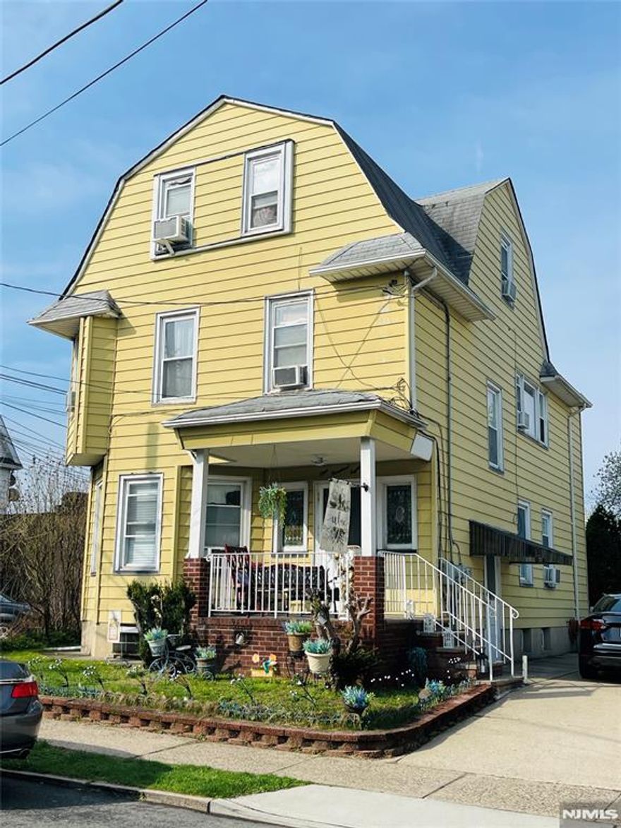 This two-family home presents a prime opportunity for both homeowners and investors. Live in one unit while collecting rental income, or take advantage of its strong investment potential with the ability to increase returns over time. The property features separate utilities, low property taxes, a private driveway, parking for up to four vehicles, and a yard ideal for everyday living and outdoor enjoyment. The first-floor unit features high ceilings, two bedrooms, an open-concept layout with a kitchen and combined living and dining area, and a full bathroom with a laundry hookup. The second-floor unit offers two bedrooms, a full bathroom, a kitchen with a washing machine hookup, a living room, and a dining room, stairs to the third floor, which includes two additional bedrooms and another full bathroom, providing flexible living space. A finished walk-out basement adds bonus space, complete with a kitchen, full bathroom, laundry hookup, and additional storage-ideal for recreation. Conveniently located near shopping, dining, major highways, and public transportation, offering an easy commute to NYC. A fantastic investment opportunity with long-term growth potential!