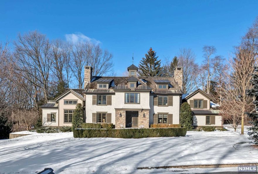 Prepare to be impressed at this stylish & glamorous stone & shingle home on a quiet cul de sac & featured in Design NJ magazine. Spanning over 6000 sq ft of living space across three levels, this thoughtfully planned 'smart home' is a showcase in sophistication and design. Unique finishes, luxurious touches & excellent build quality combine to create an upscale yet comfortable home. The layout is perfect for today's living with ample space for family, guests, working from home & entertaining. Separate pool house & heated saltwater gunite pool. See detailed brochure for the list of amenities. Top-rated school district & close to NYC bus, shops & restaurants. Don't miss this opportunity....Special homes like this one do not come along often.