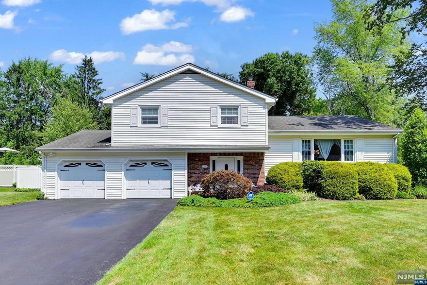 Picture perfect Sugar Maple Split set on deep private property in a picturesque neighborhood shines with price of ownership throughout.. Entry foyer welcomes you to the spacious family room with sliding doors to the patio. Features include a beautiful sun filled living room and renovated granite and stainless kitchen with breakfast bar which opens to the dining room with sliders to expansive deck. Upstairs is a king size primary bedroom with newer bath, two additional bedrooms and updated main bath. You will love the totally fenced and lushly landscaping backyard with deck and patio -- perfect for outdoor entertaining! Convenient to top-rated schools, shopping, and transportation, this home is a MUST SEE!