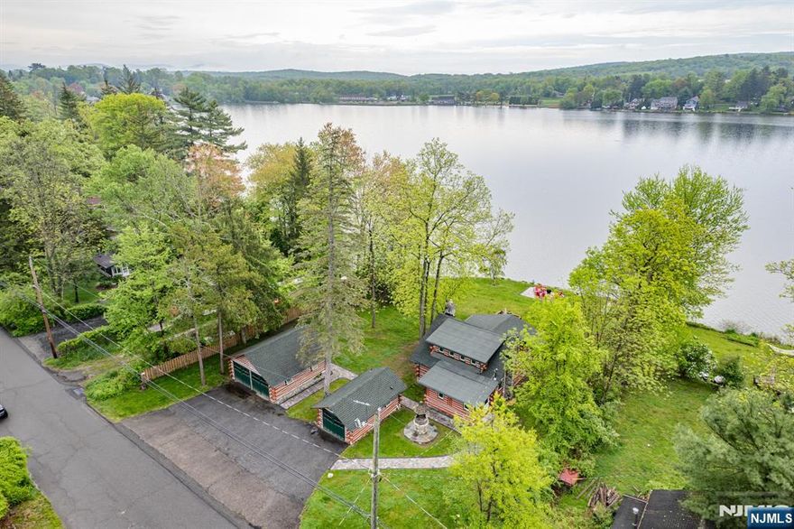 Incredible log cabin lakefront rental available immediately! Pinecliff Lake is in the center of town and so is this awesome opportunity to rent a true log home with a stunning view all year round! This comes mostly furnished so all you have to do is bring personal items, kick back and relax! Rustic charm everywhere you look! Custom built outdoor fire pit/patio area! Woodburning stone fireplace inside! 2 huge garages! Super cool loft! Awesome yard! Access to boat-kayaks! Beautifully redone stone walkway! Very well kept home! Sunrises and sunsets are spectacular and so is the fall color scheme throughout Bearfort Mountain! The pictures say it ALL!! Close to food shopping, hiking trails, farmer's markets, apple picking and highways! This is a true serene getaway!