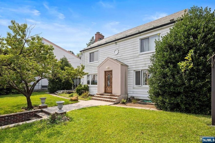 Welcome to this expansive Colonial home nestled in one of Cliffside Park's most exclusive neighborhoods. Set atop a prime clifftop location, this residence offers sweeping views of the Manhattan skyline, the Hudson River, and downtown New York City an ideal backdrop for both daily living and entertaining. The property features a spacious layout with generous rooms, perfect for customization and personal touches. The home includes a convenient 2-car garage and boasts a large lot, providing ample outdoor space for various activities. Enjoy the best of both worlds with easy access to Edgewater, NYC, and the nearby ferry. While the home does require some TLC and is being sold in AS-IS condition, it presents a unique opportunity to create your dream residence in a highly sought-after area. Don't miss out on this rare chance to own a piece of Cliffside Park with unparalleled views and potential!