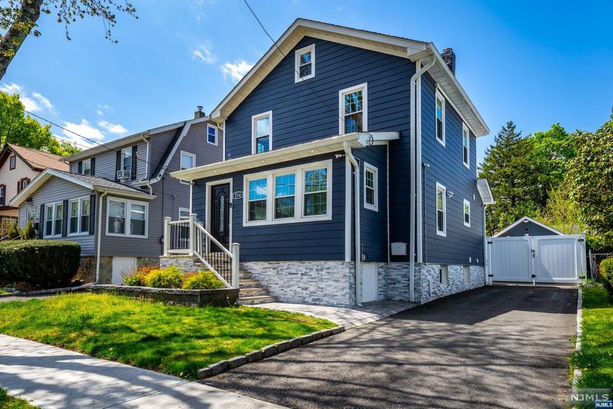 WELCOME TO 214 LEES AVE.....A STUNNING AND FULLY RENOVATED GEM IN DESIRABLE TEANECK NEIGHBORHOOD. FIRST FLOOR FEATURES AN INVITING OPEN CONCEPT IDEAL FOR FAMILY GATHERINGS, A HIGH END CUSTOM KITCHEN WITH ISLAND, SS APPLIANCES & PANTRY. PATIO DOORS RIGHT OFF THE KITCHEN LEAD YOU TO FABULOUS TREX DECK OVERLOOKING THE BEAUTIFUL FULLY FENCED-IN BACKYARD W PAVERS & ABOVE GROUND POOL. SECOND FLOOR CONSISTS OF THREE BEDROOMS, BATHROOM WITH BLUETOOTH MIRROR AND FLOATING VANITY. FOR ADDITIONAL STORAGE, CHECK-OUT FINISHED ATTIC. HOME ALSO OFFERS FAMILY ROOM IN BSMT, HOME OFFICE AND FULL BATH. REST ASSURE, FURNANCE, WATER HEATER, FENCE,DECK, SIDING,ETC....HAVE RECENTLY BEEN UPGRADED. DON'T MISS THE OPPORTUNTY TO LIVE IN ONE OF NJ TOP RATED COUNTIES. JUST UNPACK AND ENJOY YOUR NEW HOME WITH IMPRESSIVE CURB APPEAL DAY & NIGHT.