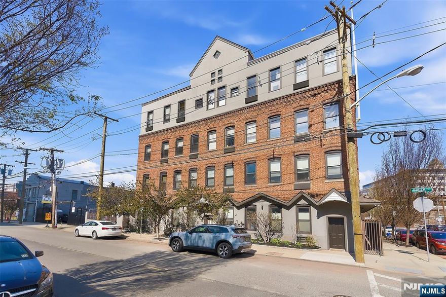 Welcome to this beautifully maintained 2-bedroom, 1.5-bath, two-story condo in the sought-after Ironbound section of Newark. This first-level unit offers convenience and style with gorgeous wood flooring throughout and impressively high ceilings on both floors, creating a bright, open feel.The main level features an open-concept layout with a spacious living room, formal dining area, and a beautifully updated kitchen complete with granite countertops, stainless steel appliances, ceramic tile flooring, and ceiling-height cabinetry for ample storage. A large breakfast counter with built-in storage is perfect for casual dining. A half bath completes the first floor.Upstairs offers two generously sized bedrooms with ample closet space, a full bath with tub/shower, and a conveniently located washer and dryer.Enjoy multiple access points including a private front entrance from Bruen Street and entry through a private gated parking lot with an assigned space. The building is locked and secure, accessible only by a secure access code.Situated just a short distance from Newark Penn Station and Ferry Street, this home is ideal for commuters. You are within walking distance to restaurants, cafes, bakeries, and nightlife, with the Prudential Center and New Jersey Performing Arts Center just a short distance away.