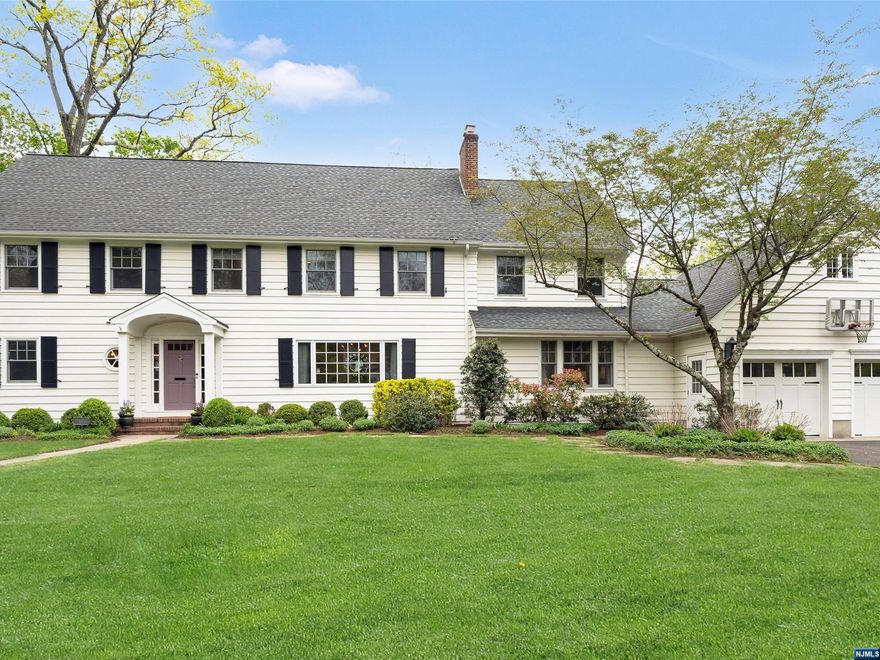 Unparalleled style and ease of living combine to give you the best Ridgewood has to offer. Nestled in the coveted Willard neighborhood, just steps from school and NYC train, this exceptional 5-bedroom colonial has been meticulously renovated to offer something for everyone! It's a fantastic entertaining home with seamless flow from room to room. The spectacular custom kitchen boasts two Quartz islands outfitted with high-end appliances and the most stunning blue cabinetry. A first floor suite welcomes guests with a relaxing sitting room and private deck, or make this your primary retreat. The magnificent primary bedroom is the pinnacle of luxury with custom walk-in closet and marble bath. A spacious finished basement includes a game room, media room, gym and full bath. Outdoor living at it's finest with a pergola-covered bluestone terrace, built-in grill and firepit that overlook the spacious yard and garden. The updates are endless. This home will capture your heart!