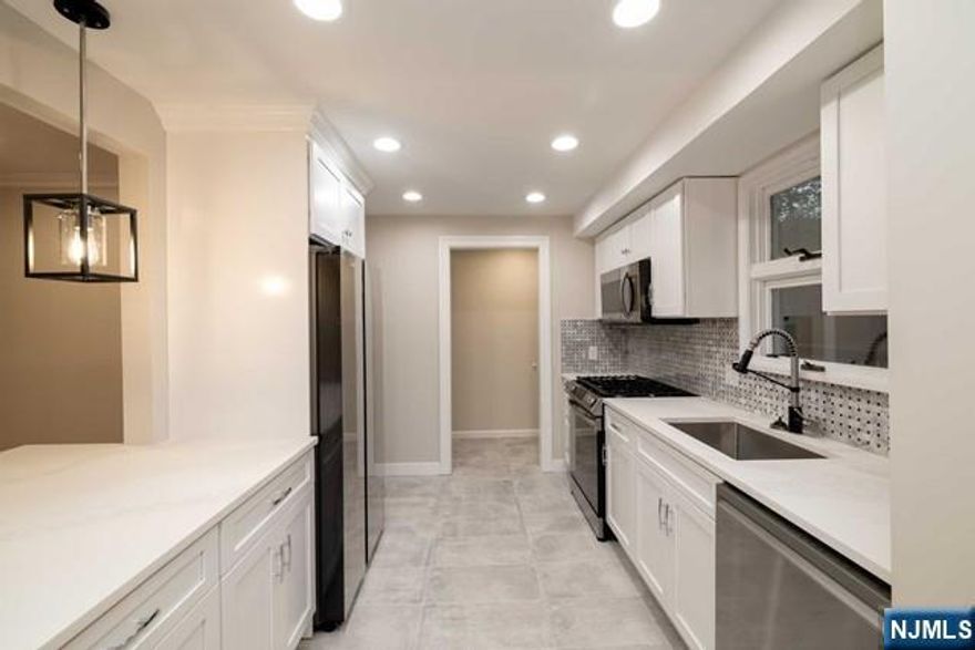 Welcome to this stunningly renovated four-bedroom, two-bathroom home. Nestled on a quiet dead-end street, this residence is your haven from the city's hustle and bustle, ensuring peaceful serenity without traffic concerns. Enjoy an open space concept that seamlessly combines a new gourmet chef's kitchen adorned with pristine, white quartz countertops and state-of-the-art appliances, a bright dining room, living room and a family/playroom. The first floor features a fourth bedroom, providing flexibility for a home office or guest room. The kitchen leads to a spacious deck overlooking a private backyard. Upstairs are three bedrooms and a new bathroom. Newly finished basement, central air, and four car parking add to the convenience. Owner has NJ real estate license. Close to top rated schools, NYC transportation, and houses of worship. Lawn care and snow removal are the responsibility of the tenant.