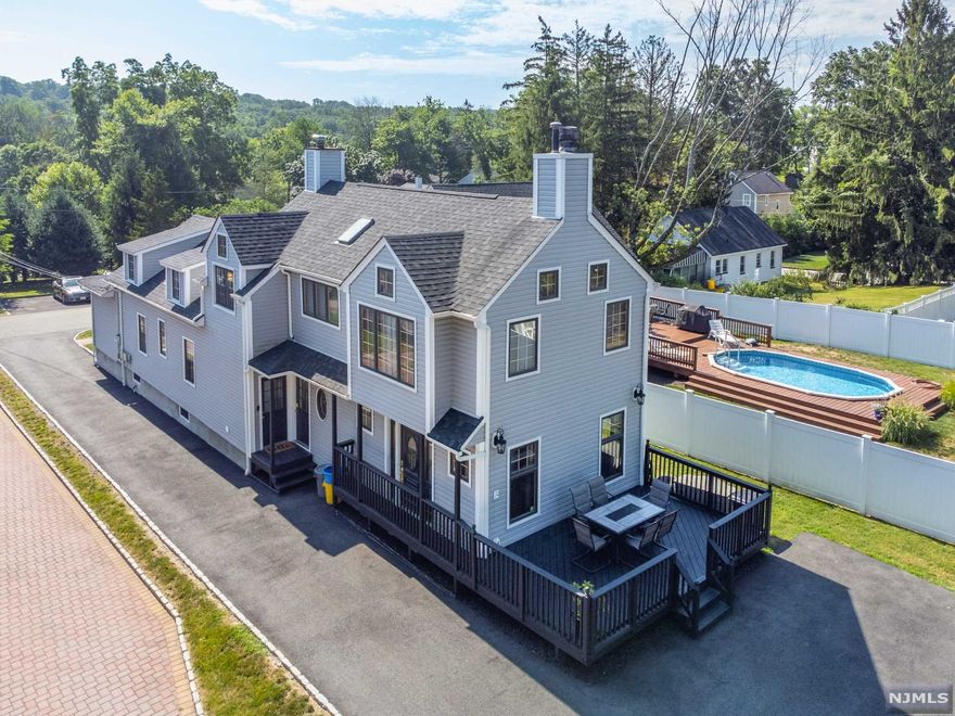 Rare opportunity to own this Beautiful, Spacious 5 Bedroom, 3 bath home located on a dead-end street in one of the most desirable neighborhoods in Cedar Grove. The home features a private master suite with a full bath and 4 additional bedrooms with 2 additional full baths. The home has a large, bright eat in kitchen with plenty cabinet and counter space. The first floor features a huge living room, formal dining room and additional large family room with a fireplace. The lot boasts a beautiful extra spacious yard as well as a deck for plenty of entertainment room. Home is set on a quiet tree lined street in the desirable North End part of Cedar Grove. North End Elementary was classified as a National Blue Ribbon School in 2021. This gem is zoned as a single-family but can be used for extended family as each unit has its own private entrance. There are 2 furnaces as well as 2 electric panels. Conveniently located for commuters with NYC bus a block away at the corner Pompton Ave.