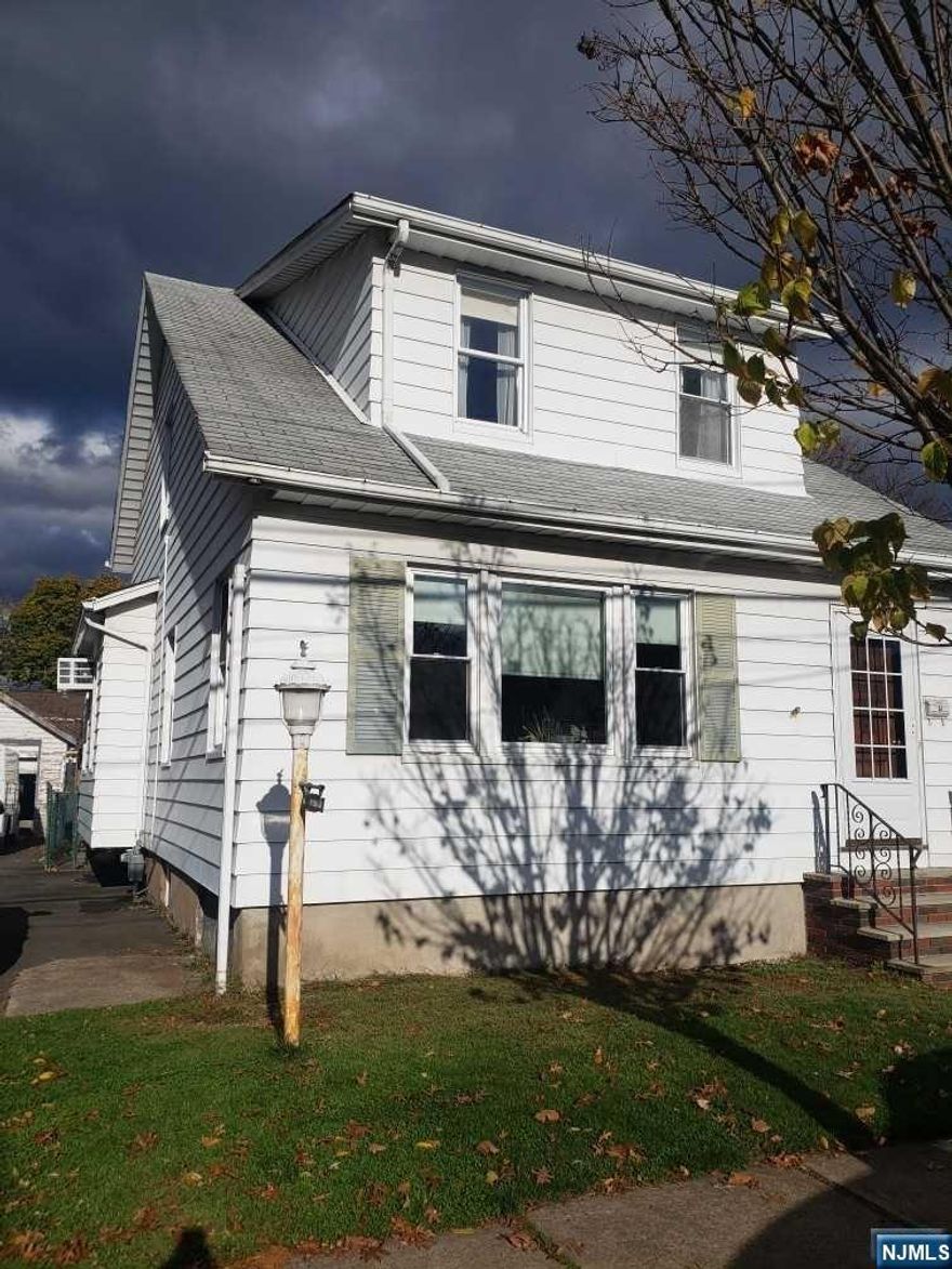 Location, Location, Location this home is a gem located in walking distance to the main Street in Town, NYC Transportation, Parks and Schools. Home features a spacious open living and dining room, with a eat in kitchen, go upstairs to 3 bedrooms and main bathroom. just needs a few updates to make this home your own.