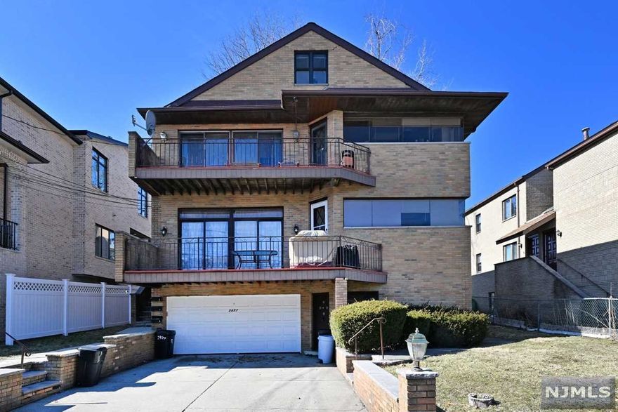 Wonderful All Brick Two Family home over 4500 sq. ft. in Prime Location of Fort Lee! First floor boasts large living room with access to private terrace, dining room, kitchen w/updated appliances, laundry, great closets, primary bedroom with WIC & private full bath, 2 additional large bedrooms and additional full bath w/double sinks. 1st floor also offers access to the updated ground floor with wet bar, 2 full baths, office and rec room. 2nd floor unit offers large living room to private terrace, spacious kitchen (appliances are as is), primary bedroom w/private full bath, 2 additional bedrooms, laundry and additional full bath. This 2nd floor unit also offers a spiral staircase to finished loft and finished large storage/office.2 Car Garage. New Roof! Separate Gas and Electric. All Windows are AS IS Condition. Perfect for owner occupied or GREAT INVESTMENT! Ground floor is part of 1st floor unit (not separate apartment) Ground floor can be delivered vacant, at buyers request.