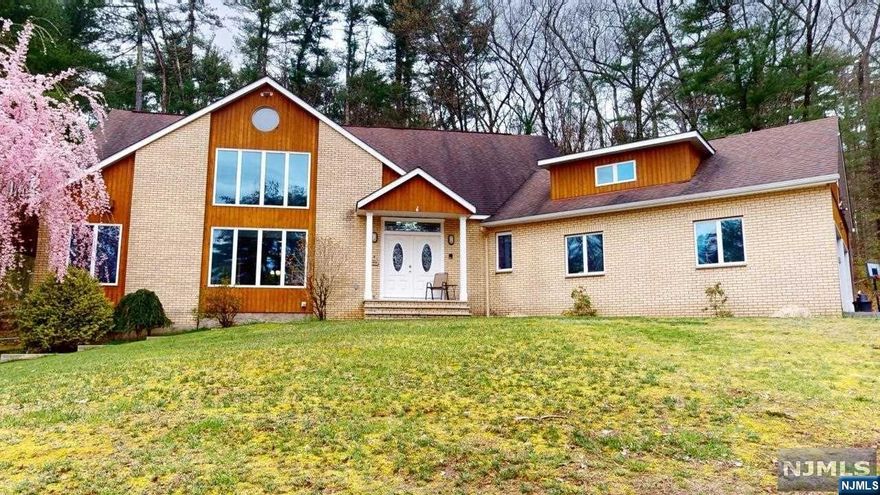 This 4042 square foot custom home is set back on 5 acres, abutting State Preserve woods. The INTERIOR features 12 rooms plus 5 Bathrooms. MAIN FLOOR: 2-story Living Room, Eat-In Kitchen/Family Room combo with Fireplace/Pellet Stove, separate formal Dining Room, two Office/Playrooms, and Mudroom; UPSTAIRS: 4 Bedrooms connected via a 39' "catwalk" (Master includes large 2nd story deck with solarium, walk-in closet and en suite) PLUS a large Bonus/Bedroom and "laundry shoot" to the main floor Laundry Room; DOWNSTAIRS: Large Recreation Room and Workshop with bay door. EXTERIOR features a large deck with planters, patio, flowering trees, and trails. Whether you find peace with nature, hiking, or just relaxing. . .alone or with others, you're sure to find your peace in this property and home. POINTS OF INTEREST: Nearby Delaware River National Recreation Area, High Point State Park, Stokes State Forest, skiing, theatre, wineries, shopping malls, etc. plus COMMUTERS: Proximity to I-84, N