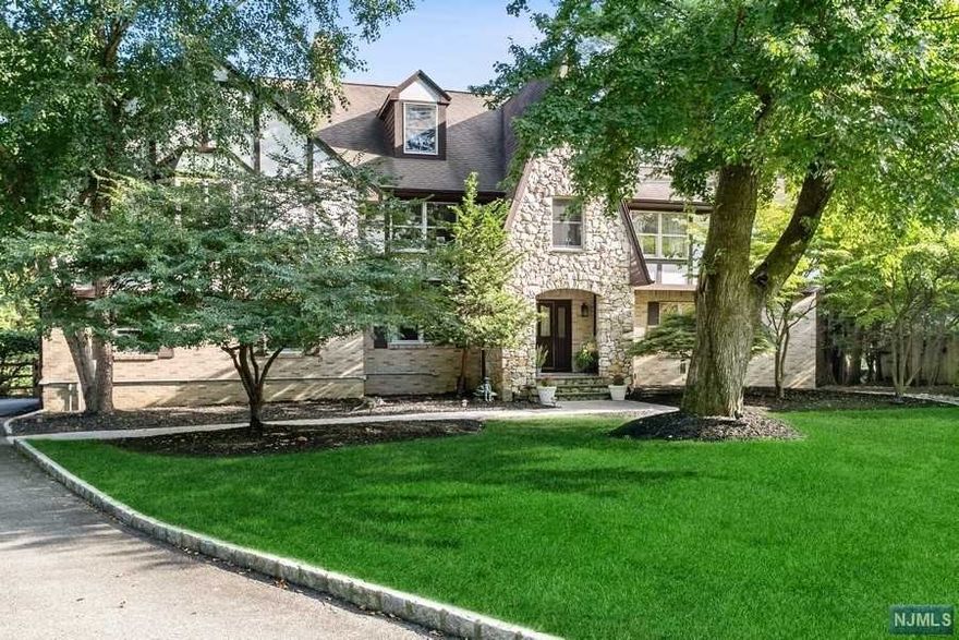 For those with a dream, opportunity is presented. Unparalleled resort style Col Tudor w/park like prop, in grnd pool embracing beautiful views of the Hackensack River awaits. No 2nd home needed when everything you could want is contained in approx 4400 int. sq. ft home. Hdwd flrs thru out.FR w/fplc connects to conv 3 rm guest/ofc suite w/fb sep. entr. Newly renov. MEIK w/ss appl overlooks encl sun room w/views of pool and river. Spectac O/S Prime Suite w/balcony/ fplc /os prime bath. 2 Huge walk-in closets. Three generous-sized bedrooms, laundry room and full bath completes the second level. 3rd level Stand up unfinished insulated attic is perfect for storage or whatever your heart's desire. Fully finished lower level featuring billiard area, rec rm, storage. Fab Detached 3 Car Garage w heated/loft. Loft perfect for office/yoga studio/gym. Brand New High-Efficiency Lennox Wifi AC System, New B&S 20KW Whole House Gen. Request List..Too many updates to list. Watch the Tour!!!