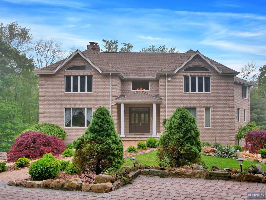 This 5 Bedroom, 4.5 Bath Colonial is nothing short of spectacular! Here you will enjoy eye catching landscaping, paver driveway leading to the 3 car garage, security system with perimeter cameras, a kitchen suited for a top Chef with maple cabinets, granite counter-tops, wine fridge, newer appliances and center island. Formal Dining Room, The Great Room and Living Room separated by a double-sided fire place. The ground floor boast a large Family Room with wet bar, pool table and French doors leading to a backyard paver patio. Vacation in your own back yard! Perfect for entertaining your guest on an oversized deck over-looking the gunite in-ground pool with under water lighting and fountains, hot tub and outdoor fire place! Too Much to List!