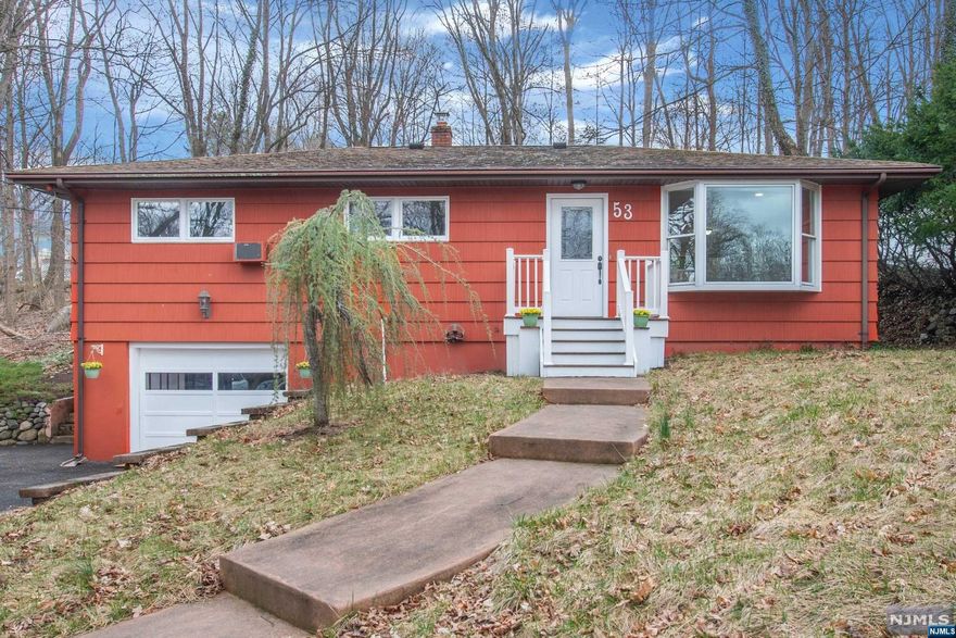 Perfect starter or downsize home conveniently located just .7 mile to the NYC Bus Stop at Rt 23/Kinnelon Rd. 3BR, 1.1 Bath with open & bright kitchen with brand new SS appliances ("smart" wall oven, dishwasher, refrigerator, venting hood & sink with deluxe sprayer faucet) + smooth electric cooktop. Natural gas for the HW baseboard heat with 4 zones to save on utilities! Garage is heated separately for anyone who loves to tinker on cars or wants separate workshop area. Laundry hookup in lower level. Public water & sewer in street (verifying hookup details with DPW). Patio off back with 2 accesses - plus a tiered yard for expanded outdoor living space.