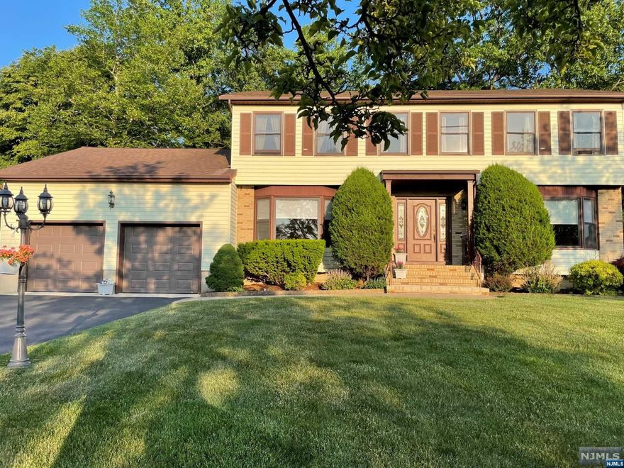 Great opportunity to own in desirable Black Oak Estates! Very spacious & beautiful 5 bedroom, 4 full bath Center Hall Colonial. The main level features the entry foyer, formal living & dining room, EIk w/sliders to a spacious deck. Also on main level is a large family room w/skylight, sliders to the deck & a wood FP. 1st Floor bedroom and full bath w/separate entrance can be used as an in-law suite. The 2nd floor features a primary bedroom en-suite w/bath & WIC plus 3 additional bedrooms. Great potential to expand over the 2 car garage. There is a walk in attic from the 2nd floor bedroom closet. Laundry hook up on the first floor in hall by 1st floor bathroom. Other features include wood floors throughout. Central air is 1 year new. Beautiful yard with room for a pool. Irrigation system. Partially finished basement with another full bath & room with a hot tub & dressing area. Great schools, near major highways, shopping, restaurants & much more!