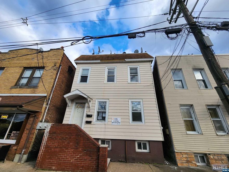 A turn of the century, a two-unit building is in need of a new owner and TLC. This property boasts 5 beds and 2 Bath. Both units have E.I.N Kitchens and separate living rooms.