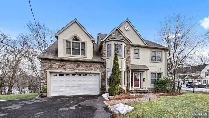 OPPORTUNITY KNOCKS!!! Situated on Hidden Grove Pond, & set on a level .5 ac lot, this 4 BR 2.5 Bath Center Hall Colonial has been beautifully maintained. Open floor plan for fine dining. High ceilings, lovely hardwood floors, & generous room sizes. This home is move-in ready. Amazing Master Bedroom w Vaulted Ceiling, walk-in closet & Master Bath with jetted tub and separate shower. Updated eat-in Kitchen with granite countertops that is open to a Family Room with a beautiful gas fireplace. Family rm leads out to a well/maintained deck that provides gorgeous views of the pond during the spring & winter season. Off the kitchen there is a huge walk-in pantry that leads to a powder room. Your laundry is also located on the first level. Central vac, lots of natural sunlight. Convenient location. Paved drive that can fit up to 4 cars, attached 2 car garage. Close to schools, shops, & more. Don't wait...this is sure to sell fast!