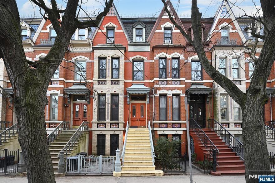 3 Hampton Court, A Downtown Jersey City Gem with Income Potential! This beautifully maintained two-family brownstone in the desirable downtown Jersey City's Van Vorst Park neighborhood offers a rare blend of classic charm and modern living, presenting an exceptional opportunity for homeowners and investors alike. Located at 3 Hampton Court, this property boasts original details, spacious layouts, and a prime location, making it a true standout. The stunning primary residence encompasses four bedrooms and two bathrooms. Step inside and be captivated by the preserved original mantles, gleaming hardwood floors, and oversized windows that flood the rooms with natural light. High ceilings amplify the sense of spaciousness, creating an airy and welcoming atmosphere. Three generously sized bedrooms provide ample space, while a dedicated laundry room adds modern convenience. The ground-floor apartment is equally impressive, featuring hardwood floors throughout, a spacious bedroom, and desirable outdoor space perfect for relaxing or entertaining. The kitchen is a chef's delight, showcasing stylish shaker cabinets accented with unique textured glass, and complemented by exposed brick that adds a touch of industrial chic. This versatile space offers excellent potential for rental income or multi-generational living. Beyond the individual residences, 3 Hampton Court's location is unbeatable. Nestled in the heart of downtown Jersey City, you'll enjoy easy access to transportation, includi