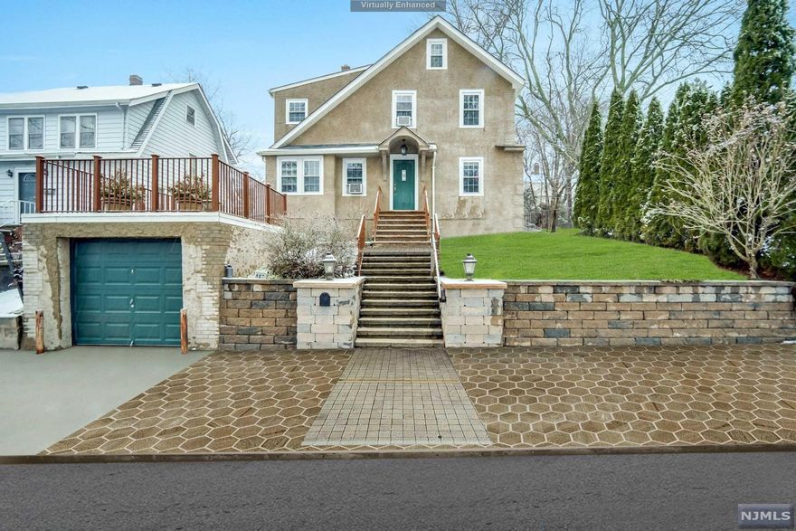 Sunny & bright center hall colonial 3 bedroom plus den with 2 full bath/ one on each floor, Hardwood floors though, finished basement & attic/ windows for the extra space, one car Garage / its black roof top, level 2 tier rear yard, 1st floor offers a living room with a fire place lead to the den, updated full bath/ shower, formal dining room, updated granite kitchen with rear back door to the patio & 2 level back yard. 2nd floor offers 3 bedrooms, updated full bath/tub, and stair to a finished attic with windows and full finished basement/ utility room, washer & dryer, sink, and some recreation area, storage, Better school systems. Close to NYC BUS, Both Schools,