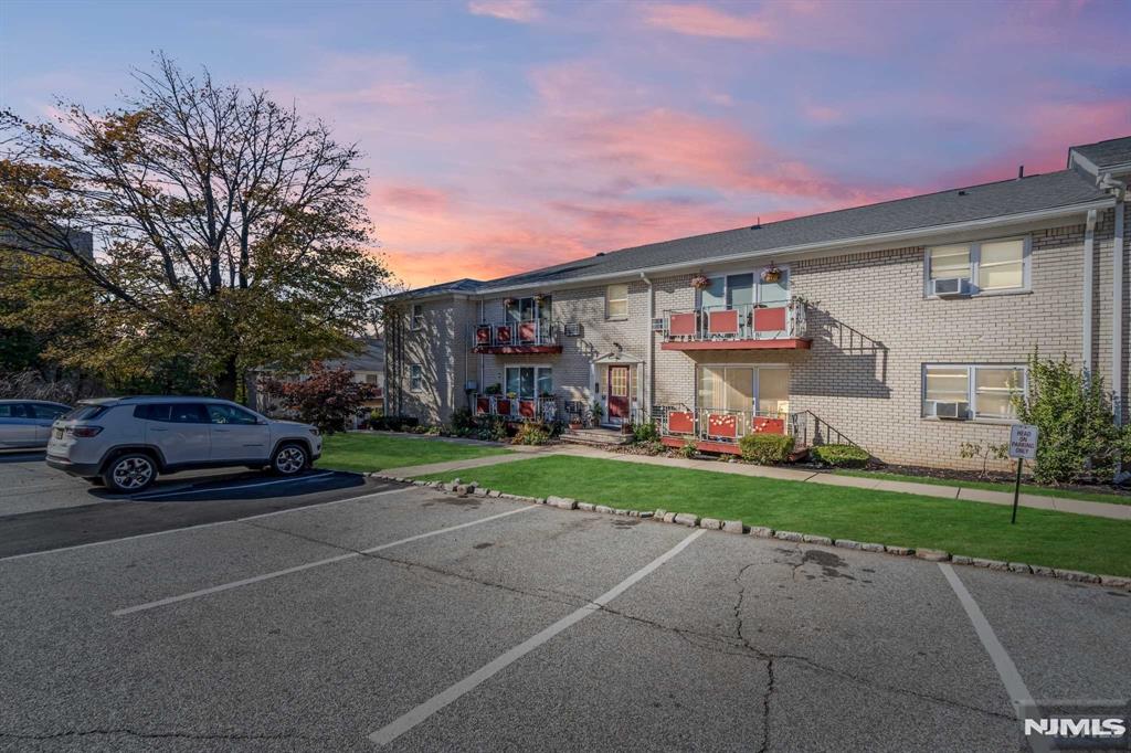 This modern first-floor unit features gleaming hardwood floors, fresh paint, and a bright, clean layout. The unit includes a wall A/C, stove, microwave, ceiling fan, and a private balcony to relax. Heat and hot water included. The complex is peaceful yet centrally located, just two blocks from NYC transportation. Enjoy plenty of open parking and easy access to a coin-operated laundry facility in the adjacent building. Perfect for those seeking a quiet and convenient lifestyle!