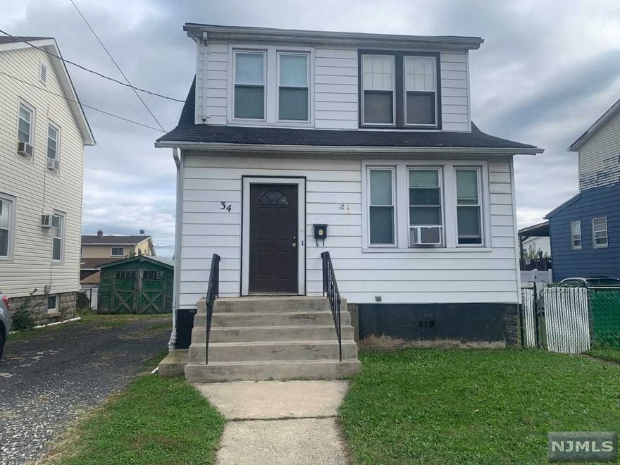 Large lot. Modern eat-in kitchen with oak cabinets. Living room has track lighting. Hardwood floors throughout. Large wood deck 13.4x18.2. New bath on 2nd fl. New gas range. Living Rm: 16.4x11.8, Dining Rm: 12.7x11.1, Kitchen: 16.8x7.5, Bedrooms: 10.7x14.1, 12x8.9, 8.1x7.8. Party driveway. Has room for a private driveway on the right side. Short Sale, subject to 3rd party authorization, as is condition.