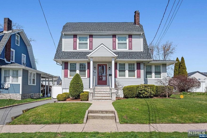 Discover this exquisite 4-bedroom, 2-bath Colonial home nestled in the heart of Elmwood Park. From the moment you step inside, a warm living room, complete with a cozy wood-burning fireplace, sets the stage for comfortable living and entertaining. The formal dining room is perfect for hosting gatherings & enjoying cozy family meals, while the versatile home office/den provides ample space for work or leisure. The heart of this home is the beautifully updated kitchen, boasting granite countertops, & a center island providing ample storage & workable counter space. Adjacent to the kitchen, you will find a rear enclosed porch with a full bath. The second and third floors offer four bedrooms & an additional full bath. Outside, the property features a large 5-car driveway leading to an oversized detached garage, a tranquil backyard enclosed with a white vinyl privacy fence, & a composite deck for outdoor enjoyment. Add'l features include a full unfinished basement & 200-amp service