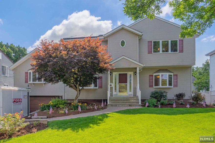 Light & bright! Welcome to this wonderfully kept home offering 6 bedrooms & 4 full baths in premiere location of Paramus, just steps away from Ridge Ranch elementary school on quiet, tree lined street with great curb appeal. This colonial style home was once a ranch & was expanded for extended family living,& perfect for work from home potential. You will feel like you're on vacation relaxing on the deck, hosting family & friends, overlooking the 75x125 flat lot property featuring the above ground pool. Welcoming entry, bright living rm, formal dining rm, kitchen & breakfast area, 3 bedrooms & main full bath on 1st flr. Upstairs features the lovely primary BR with primary bath, jacuzzi soaking tub & shower, walk in closet & double closet, two additnl bedrooms & full bath. Lower level features a rec rm w/bar,workshop, additnl full bath,2 car garage w/door to yard. Hardwood flrs As/In, ample closets,two zone C/A,& so much more. Close to shopping,NY trans & major highway & LOW TAXES!