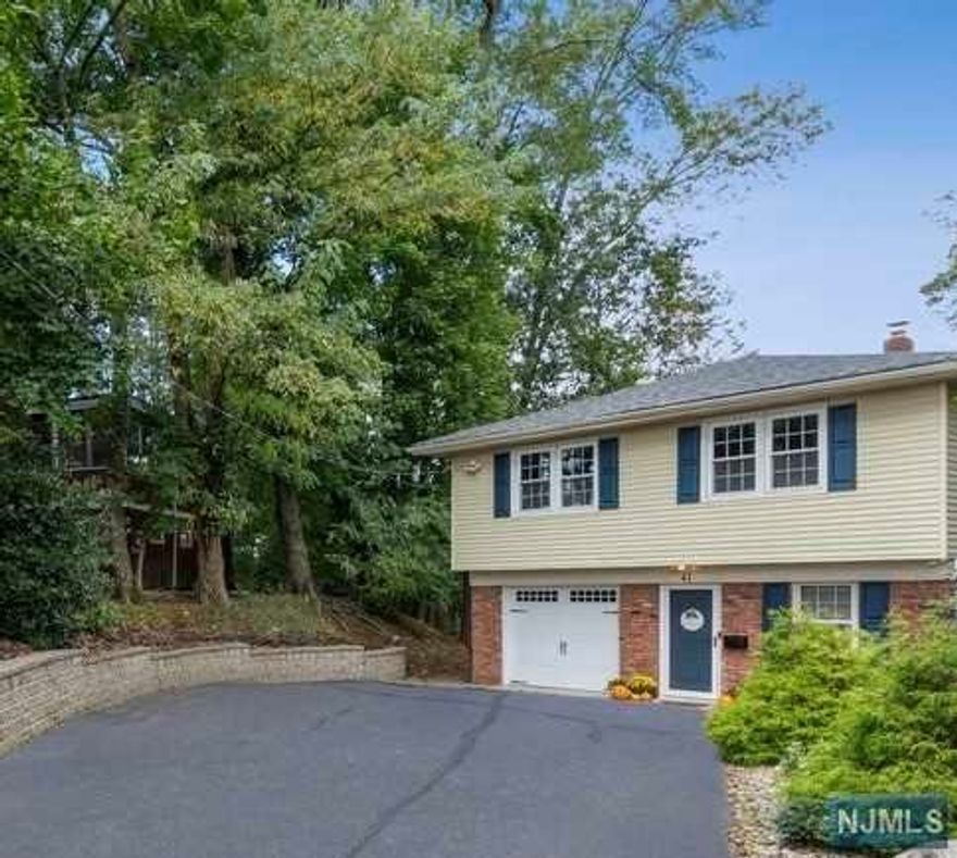This beautiful turn-key home is located in the desirable town of Norwood and minutes to all amenities including both the k-8 elementary school and the top-rated NVOT high school (Ranked the best district in Bergen County and # 2 in the state). Highland Park and the upscale WholeFoods shopping center are also min away. This home is move-in ready with numerous upgrades. The spacious entry foyer leads to a large step down bright family room with high ceilings, bar and gas fpl w/stone surround. Sliders off the family room lead to a large deck which overlooks the private backyard. A perfect work from home space or guest bedroom is also located on this level, in addition to a full bathroom and laundry room. Upstairs, the updated kitchen opens to the sun filled living room & dining room providing a great open space for entertaining. Also included on the upper level is the primary bedroom & two additional well proportioned bedrooms w/full bath. Extensive list of home improvements!