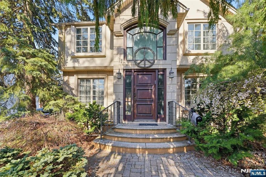 Experience elevated living in this expansive Center Hall Colonial, ideally located in one of Teaneckâ€™s most sought-after neighborhoods. Offering generous space and thoughtful design, this home provides convenient access to houses of worship, top-rated schools, parks, and NYC transportation. A sun-filled two-story foyer welcomes you into a warm and inviting layout. The main level features a spacious living room with a wood-burning fireplace and a bright family room with French doors that open to a beautifully landscaped backyard and patioâ€”perfect for entertaining. The oversized kosher kitchen is designed for both function and style, complete with dual islands, double ovens, two dishwashers, premium appliances, custom cabinetry, granite countertops, and a striking brick backsplash, flowing seamlessly into the formal dining area. A powder room completes the first floor. Upstairs offers three generously sized bedrooms, a full bath, and a stunning primary suite with vaulted ceilings, a spa-like bath, and a custom walk-in closet. A sunlit office adds flexibility for todayâ€™s lifestyle. The unfinished basement includes a laundry area and half bath, offering endless potential to customize. A rare opportunity to own a spacious, well-appointed home in a prime location.