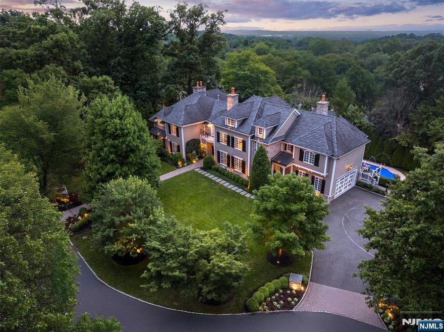 Welcome to 11 Hamilton Road, a bold, reimagined residence offering over seven thousand square feet of high-design, comfort and smart functionality. With seven bedrooms, five en-suite full baths and three half baths, this home blends custom luxury flooring, designer lighting, detailed millwork and spa-style baths with flawless flow. The chefâ€™s kitchen stuns with premium appliances, a dramatic hood and a cozy banquette with its own fireplace. The main level offers open-concept living anchored by a gas fireplace, natural stone accents and a rear staircase. Upstairs, the primary suite impresses with a fireplace, sitting room or office and spa bath, joined by four additional en-suite bedrooms and a second-floor laundry room. The third floor is an ideal private office. The full walk-out lower level features a sprawling rec space, another en-suite bedroom, half bath and additional laundry. Outside, enjoy a resort-style pool, waterfalls, fire pit, upper deck and lush, private grounds.