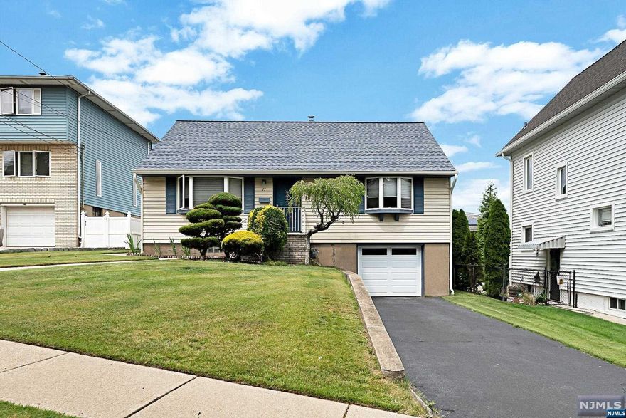 Great opportunity to get into sought after Hasbrouck Heights. This lovely, cared for home is located on a dead end street and has great curb appeal. First floor offers living room, dining room with sliders to a deck, kitchen, full bath and two bedrooms. First floor has hardwood floors under carpeting. The second level features two bedrooms. The basement is finished with a full bath, laundry and access to the attached garage. Other features of this home include central air, walking distance to transportation, fenced in yard.