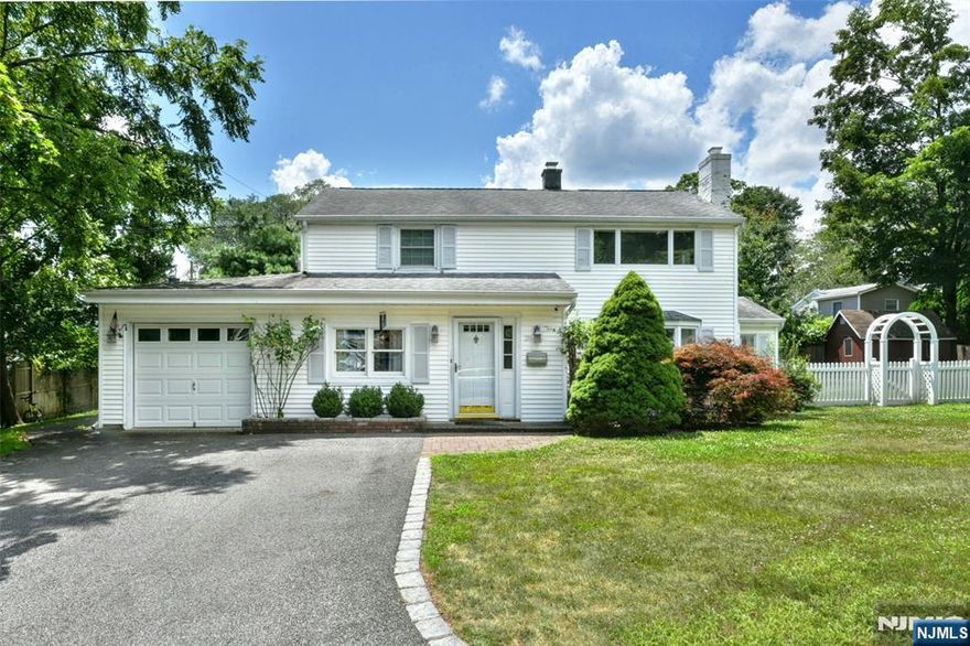 Discover WALDWICK! Welcome to this beautifully maintained 4-bedroom, 1.5-bath Colonial located in the desirable Highlands section of Waldwick! This home offers a warm & inviting layout with an open-concept first floor featuring a spacious living room with fireplace, formal dining area, + an updated eat-in kitchen with a Wolf 6 burner gas range, perfect for everyday living & entertaining. Also on the main level, you'll find a powder room, laundry area, and bonus room ideal as a media room, home office or playroom. The second floor offers 4 generously sized bedrooms, including a primary suite with a spacious walk-in closet. A full bath completes the second floor, along with Bessler stairs that provide easy access to a spacious attic for additional storage. Enjoy the stylish flooring throughout, central air to keep things comfortable, and a generous 1-car garage complete with a built-in workshop areaâ€”perfect for hobbies or projects. Step outside to a beautifully landscaped oversized lot w/ underground sprinklers to keep the lush lawn vibrant. The backyard is an entertainer's dream, complete w/ a stunning patio & built-in chef's grill with a powerful single burner too, perfect for summer gatherings and outdoor fun. Whether you're looking to expand, garden, or just relax, the yard offers endless possibilities. Don't miss this opportunity to live in a wonderful neighborhood with top-rated schools, close to parks, NYC transportation, and all that Waldwick has to offer!