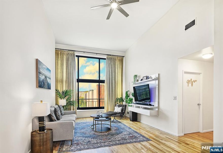 Step into this Modern Flair Loft style 2 Bed 2 Bath duplex Condo in thriving Weehawken! Greeted by one of a kind, captivating loft features from soaring 14ft+-ceilings to gallery walls & supersized newer energy efficient windows complete w/ custom window treatments. Boasting character & charm in design. A stand out feature is the impressive grand sized floor to ceiling window that anchors the generous 1370+-sq. ft. floor plan. You're always guaranteed an abundance of warm natural light & colorful sunsets Enjoy the beauty & flexibility of the generous 2 story floor-plan with 1 bedroom & full bath on each level for guaranteed privacy. The Modern eat-in-Kitchen is equipped with Quartz Calcutta counters, backsplash, SS appliances & opens to the dining space. Travel upstairs to the thoughtfully designed Loft Bedroom, with en suite full bath & walk-in-closet. A full size w/d on level 1. HOA inc. 1 garage parking; h/c water. Amenities; 24hr concierge, fitness, Indoor Pool, Sauna, Lounge. Discover Gregory Commons gated luxury condo complex. An amazing location-situated atop the bluffs in thriving Weehawken. Nearby Whole Foods, Lidl et al. Trader Joe's. Terrific Restaurants, Cafes, Lincoln Harbor Waterfront; Tennis courts, Reservoir Park. A Dream Commute to NYC is just 2 blocks away; Via NJ Transit Bus, Lincoln Tunnel, Train. Only 2-miles to NYC Port Auth. Hassle free commuter options are all close by. Contact/text Angela Cuciniello direct for Details 201 657-6084. Don't Miss Out!