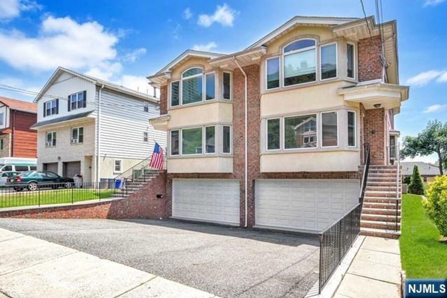 Elegant 3-level townhome with skylights, an abundance of natural light, and located on the south side. Gourmet kitchen with GE Profile stainless steel appliances, Granite countertops, marble center island, walk-out balcony off kitchen facing GWB & NYC water views. Large dining and living room with fireplace, a powder room and laundry room. The second floor has a primary bedroom ensuite with 2 additional large bedrooms and a full bathroom. Extra hallway closet, central vacuum, and hardwood floors throughout. The lower level consists of very bright large windows, new carpeting, a bedroom/family room or office space, and a bathroom. Newer Whirlpool washer & dryer, large screened video intercom, ADT Security System, and entire home will be freshly painted! Beautifully landscaped backyard area for BBQ! Two-car garage, excellent schools close by, and minutes to Edgewater/ NYC ferry, GW Bridge, shopping, transportation, and restaurants.