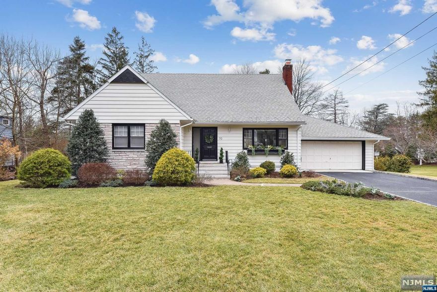 Nestled on a large level lot in the Great Notch section of Little Falls (NON-FLOOD), this home is totally turnkey. Recently featured in NY times low-key suburb 20 miles from NYC. All large rooms throughout with a very open flexible floorplan for today's lifestyle. This home is streaming with outdoor light indoors. Low taxes just one of the many positive features here. NY bus and train conveniently located a short distance away for commuting. Gourmet kitchen overlooking level yard with granite counters with kitchen bar many cabinets 5 burner stove. Hardwood floors, hunter douglass blinds, Florida room on first floor with 3 walls of windows.