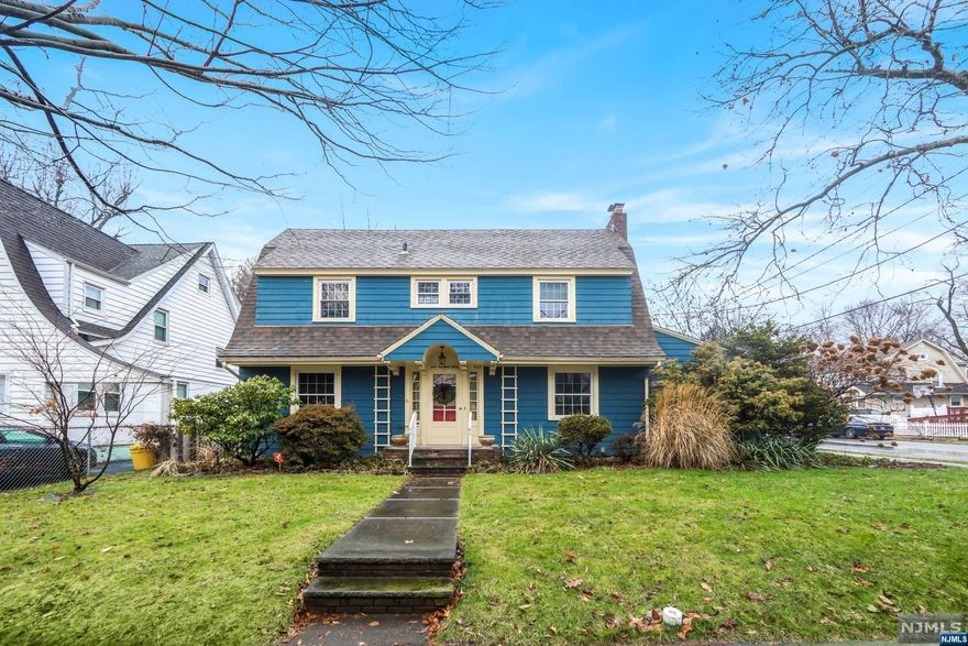 Welcome to this charming center hall colonial home in Teaneck. When you walk in, you will find yourself in an airy and open entry foyer with Venetian Plaster ceiling. The first floor of the house also features a formal dining room, great sized living room with a wood burning fireplace, a cozy den off the living room, a cheerful eat in kitchen with stainless steel appliances, and a 1/4 bath off the kitchen. The second floor of the home is connected by a beautiful open staircase, and boasts a spacious primary bedroom with 2 closets, a nice sized Jack and Jill bathroom, 2 additional bedrooms, and access to the walk-up attic accessible through the hallway. Additional features include hardwood floors throughout the home, a quiet and private backyard that includes a large patio and a lovely perennial garden, and spacious 2 car detached garage. The property is located close to parks, houses of worship, shopping, and transportation into NYC.