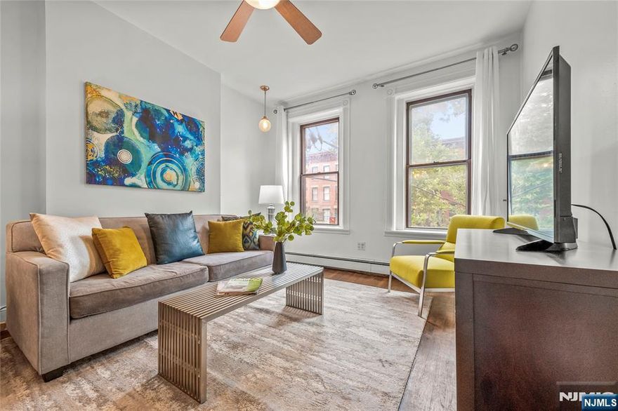 Welcome to 297 Pavonia Ave Unit 2A, a beautifully updated 2-bedroom, 2-bathroom duplex in a classic brownstone just one block from Hamilton Park in downtown Jersey City's most coveted neighborhood. This thoughtfully designed home has been extensively renovated throughout 2024 with a renovated master bathroom shower, updated first floor bedroom, new kitchen insert lighting, new washer/dryer, built-in Murphy style dining table, new hot water heater, all three faucets replaced, and the entire apartment freshly repainted. Located in Hamilton Park's historic Victorian district, you'll enjoy immediate access to the 5.4-acre park's year-round activities including Shakespeare in the Park performances, outdoor movie nights, weekly farmers markets, the annual Hamilton Park Festival, children's playgrounds, tennis courts, and splash pad. The vibrant neighborhood boasts acclaimed dining at Chickie's Italian restaurant, authentic Cuban cuisine at Rumba Cubana, beloved Hamilton Inn and Hamilton Pork, plus local favorites like WORD Bookstore and Milk Sugar Love creamery. Commuting to Manhattan is effortless with nearby Newport and Grove Street PATH stations providing direct NYC access with trains running every 4-5 minutes during peak hours, operating 24/7. This move-in ready duplex perfectly combines historic brownstone character with modern conveniences in Jersey City's most desirable neighborhood. Schedule your tour today.