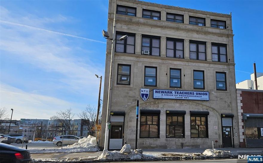 FULL-FLOOR COMMAND CENTER ON BROAD STREET: 4 PARKING SPOTS INCLUDED. Secure your brand in the heart of Newark's Tech and Finance District. Anchored by the highly stable Newark Teachers Union, 1019 Broad Street offers a 2,832 sq ft, full-floor 2nd-floor suite designed for high-performance firms, creative agencies, or educational centers. THE SPACE: Experience total privacy and prestige on your own floor. This sun-drenched, open-concept suite features wraparound windows with expansive city views. Includes elevator and stair access, private dual lavatories, and a versatile layout zoned C2 for Office or Day Care. This is a move-in ready sanctuary for law firms, startups, or professional firms. THE UNBEATABLE ADVANTAGE: Rare and valuable FOUR (4) ASSIGNED PARKING SPACES INCLUDED in the rent. Located in a premier transit corridor with NJ Transit Bus/Rail, Newark Light Rail, and PATH trains to Manhattan at your doorstep. Just 13 miles to the Holland Tunnel and 4 miles to EWR Airport. DOWNTOWN SYNERGY: Steps from the Prudential Center, NJPAC, Newark Symphony Hall, and the Essex County Courthouse. You are walking distance to Rutgers, NJIT, the Federal Building, and the vibrant Ironbound District. LEASE TERMS: Immediate occupancy. Minimum 3-year lease (up to 10 years preferred). Flexible options for the right visionary tenant. COMMAND THE BLOCK. Prospective tenants are advised to verify all intended business usage with the Newark Zoning Department at (973) 733-6333.