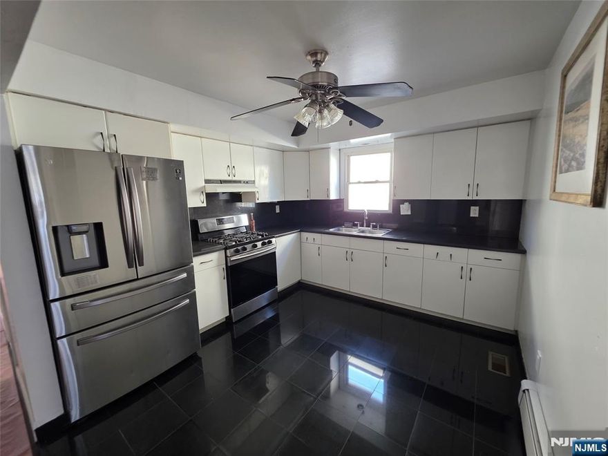 Enjoy comfortable living in this well-kept first floor 3 bedroom 1 bathroom apartment in Belleville. Hardwood floors run throughout the home, complemented by a generous living and dining space thatâ€™s perfect for relaxing or entertaining. The kitchen has been updated with modern countertops and backsplash. Tucked away on a quiet street yet just minutes from shopping, public transportation, and the Garden State Parkway, this home offers the perfect balance of peace and convenience.