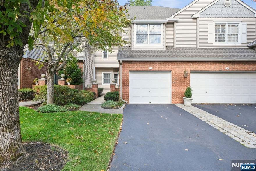 Don't miss this stunning and beautifully updated townhome situated in a prime location, surrounded by lush landscaping. This meticulously maintained home features 2 spacious en suite bedrooms, one of which is the primary suite with a tastefully designed bathroom, and LARGE walk in closet. The BRAND NEW kitchen features stainless steel appliances, quartzite countertops and backsplash. Enjoy an open, airy floor plan with an abundance of closets and storage throughout. The dining room opens through sliding glass doors to a Trex deck, overlooking a serene, tree-lined landscape--perfect for relaxing or entertaining. The finished lower level (walkout), provides endless possibilities for additional living space....a bedroom, home office or a gym. A one car garage adds convenience and functionality. Residents can unwind at the community outdoor pool or enjoy the tennis/pickleball courts. Easily accessible to shopping, schools, and major highways, this home truly combines comfort, style, and convenience.