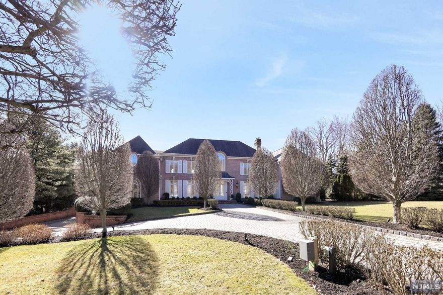 An all brick French Chateau nestled on one acre is located on a tree-lined cul-de-sac. The beautiful home was built by custom builders Commorata-Berardi and has exquisite detail with custom woodwork throughout. First floor has a beautiful billiard room and library that leads to an open finished basement. The open finished basement features a movie theater with a concession stand and a gallery that would be perfect for a play area, a gym and/or a yoga studio. The basement also has a full bathroom. The private backyard is your own oasis with custom blue stone patios, a 300 square foot pool house consisting of a full bathroom, built-in grill, central AC and heating. A 22x42 newly refurbished gunite pool is surrounded by manicured gardens and a pond. Features of the home include a sonos system, two back up generators, five car garage and a newly updated alarm system. Agent is related to the Seller.