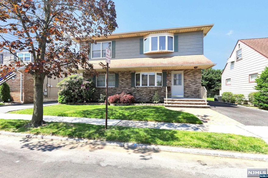 Exquisite 5 bedroom 4 full bath Colonial home, conveniently located in the quiet western-side of E. Rutherford. Skillfully expanded in 1989 to provide an exceptional, extended-family living experience w/the option to convert to a 2-fam home w/ease. Property provides the WOW factor for all buyer tastes. The 1st level floor plan includes a living room, large eat-in-kitchen w/plenty of storage, access to deck, 2 generous size bedrooms, and full bath. Enter the 2nd floor to a spectacular open-floor layout w/beautiful sun-filled living-room, large eat-in-kitchen, laundry room, very nice deck perfect for summer entertainment, primary bedroom w/bathroom, 2 generous size bedrooms w/plenty of closet space, and a full bathroom. Relax in the beautifully landscaped backyard with in-ground pool. Home also boasts hardwood floors throughout, 2-zone central AC/heat. Full basement offers a kitchenette, full bath, washer/dryer, and storage. Driveway provides ample room for 3 car parking.