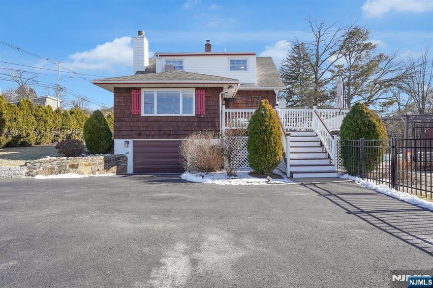 Stunningly renovated home in the heart of Montville with an open floor plan designed for modern living. Sunlight floods the space through many large windows, including two picture windows that create a bright and inviting atmosphere throughout. The gourmet eat-in kitchen is a chef's dream, featuring a Viking stove, custom cabinetry, granite countertops, and an island with seating perfect for cooking, casual dining, and entertaining. The adjacent dining area boasts a built-in bench with ample seating, ideal for gatherings, and a convenient powder room completes this level. The family room, centrally located on the main floor, offers a cozy atmosphere with a stunning stone fireplace and sliders that lead directly to the deck, blending indoor and outdoor living seamlessly. The primary bedroom, also on the main level, offers a serene retreat with a beautifully updated en-suite bathroom and a spacious walk-in closet. Upstairs, you'll find two additional bedrooms and a full bath, providing plenty of space. The lower level includes a laundry area with extra space for storage or recreation, adding valuable flexibility to the home. Outside, enjoy your own private oasis with a sparkling pool, lush garden, and a fully fenced-in yard. A large deck overlooks the pool, creating the perfect setting for outdoor entertaining and relaxation."